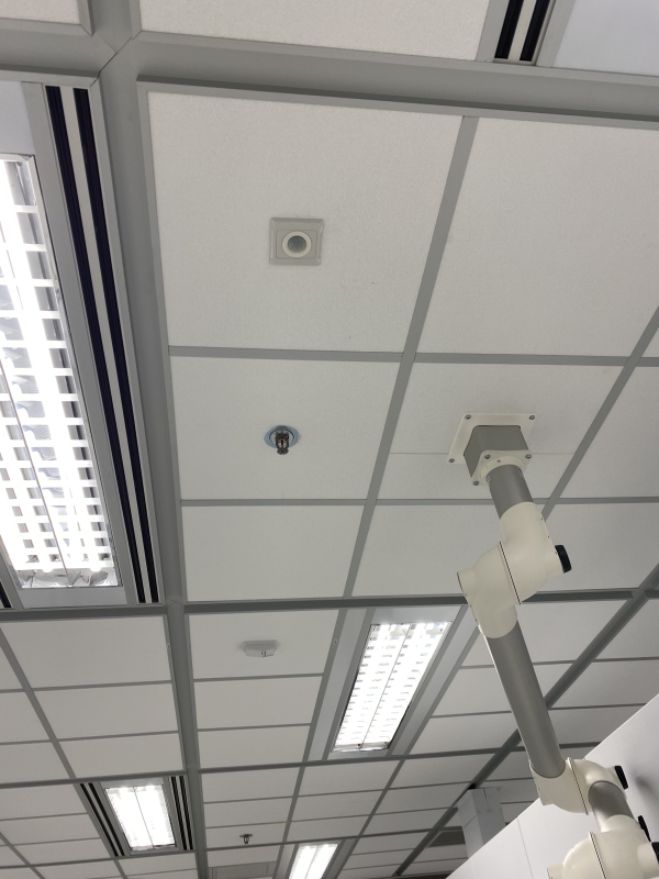 During unoccupied periods, LED lighting is dimmed or turned off after 15 minutes of inactivity; the temperature set point is increased by 2°C through the Building Management System (BMS), which also enforces a minimum flow set point at the VAV box.